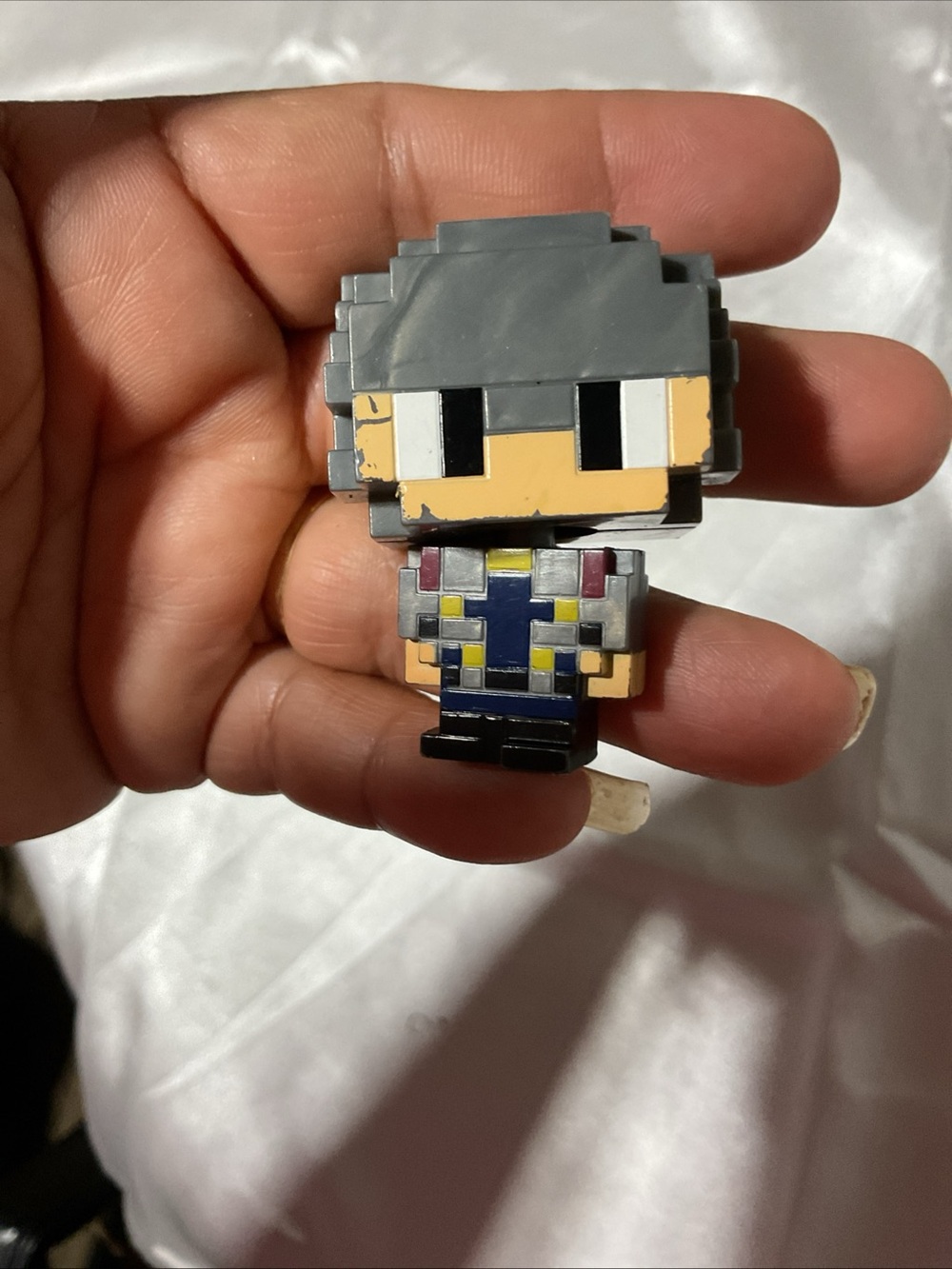 Gray Pixel-Style Wearable Accessory